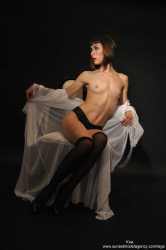kira-topless-and-stockings-image-9